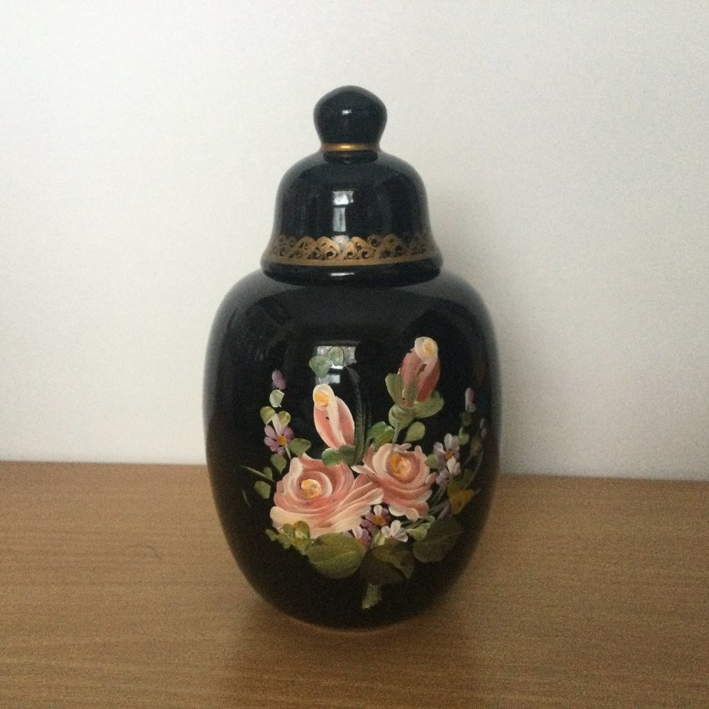 Hand painted black lidded jar decorated with flowers signed made in Portugal